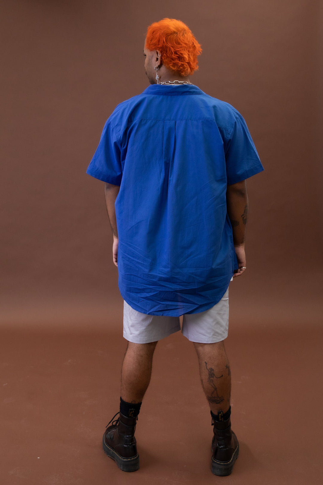 Cobalt JAM the Label short sleeve shirt displayed from the back, featuring a stylish magnetic closure design.