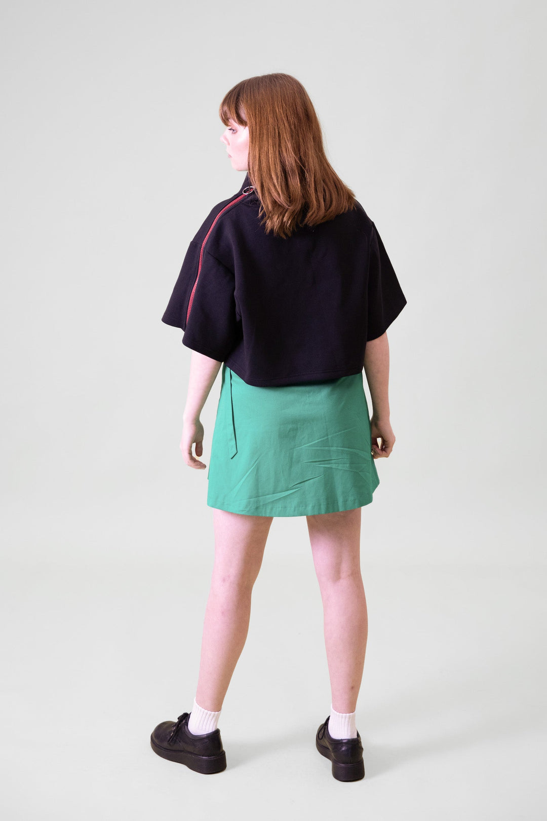 Back view of JAM the Label cropped neoprene zip pullover, showcasing its fitted style and sleek design.