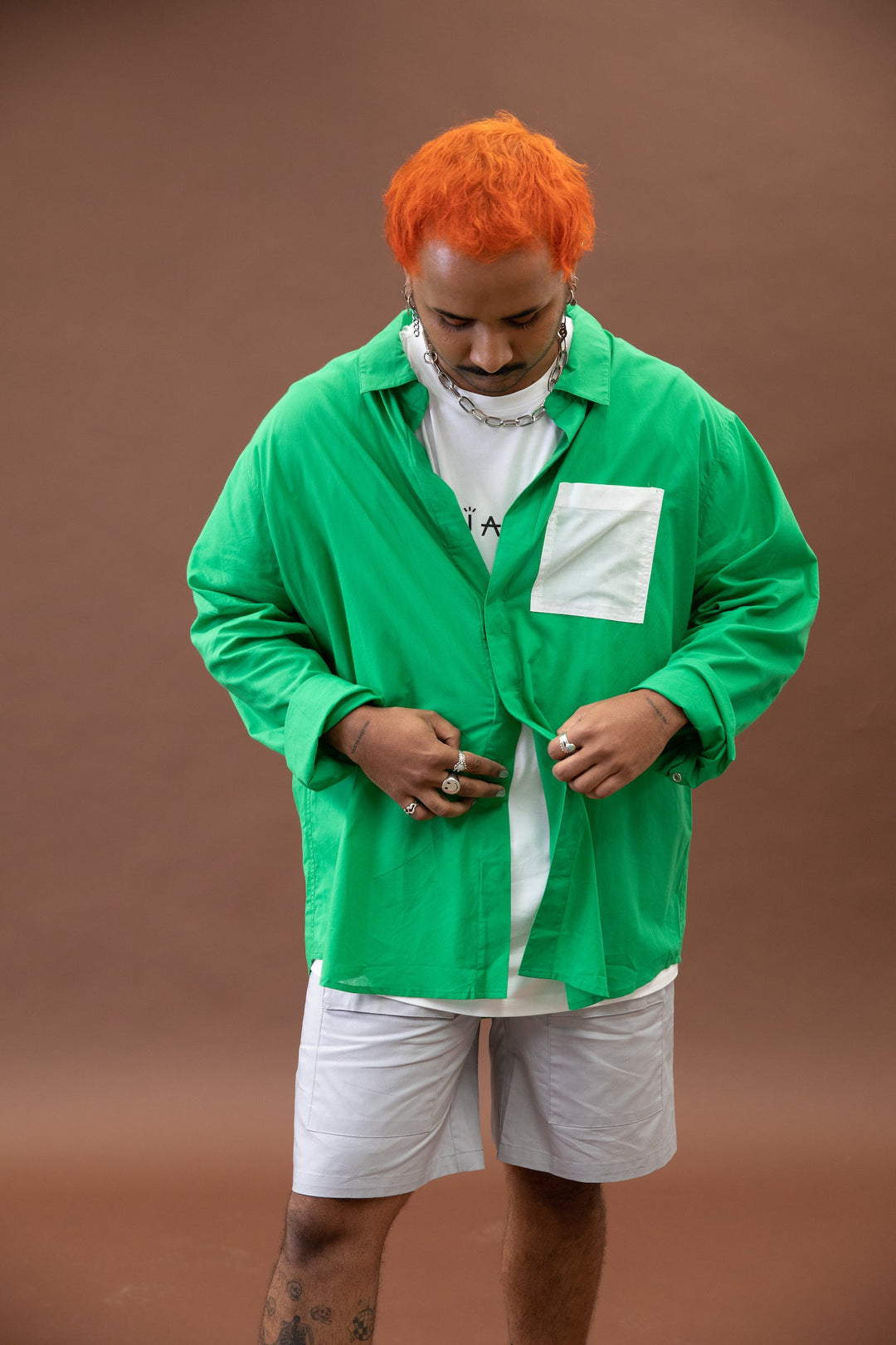 Green JAM the Label Magnetic Long Sleeve Shirt displayed on a model, showcasing the unique magnet feature and stylish design.