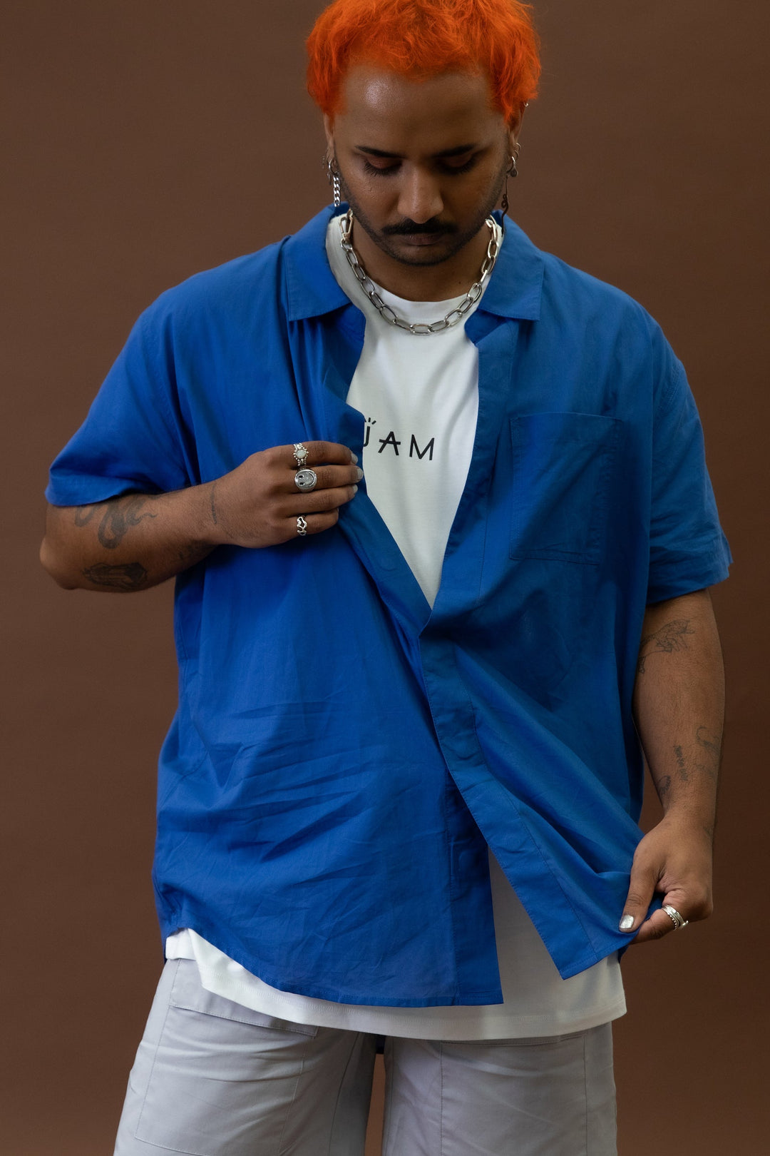 Cobalt short sleeve shirt by JAM the Label, featuring a close-up of the magnetic closure detail.