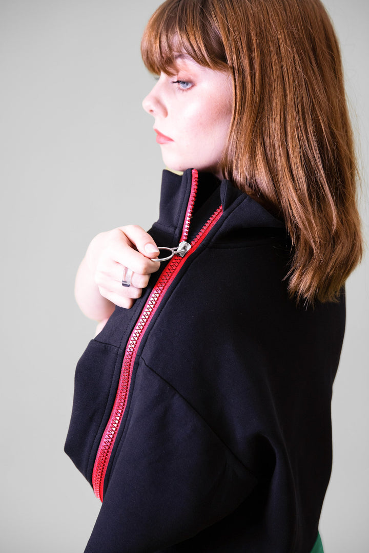 Close-up of JAM the Label Cropped Neoprene Zip Pullover showing the zipper detail and fabric texture.