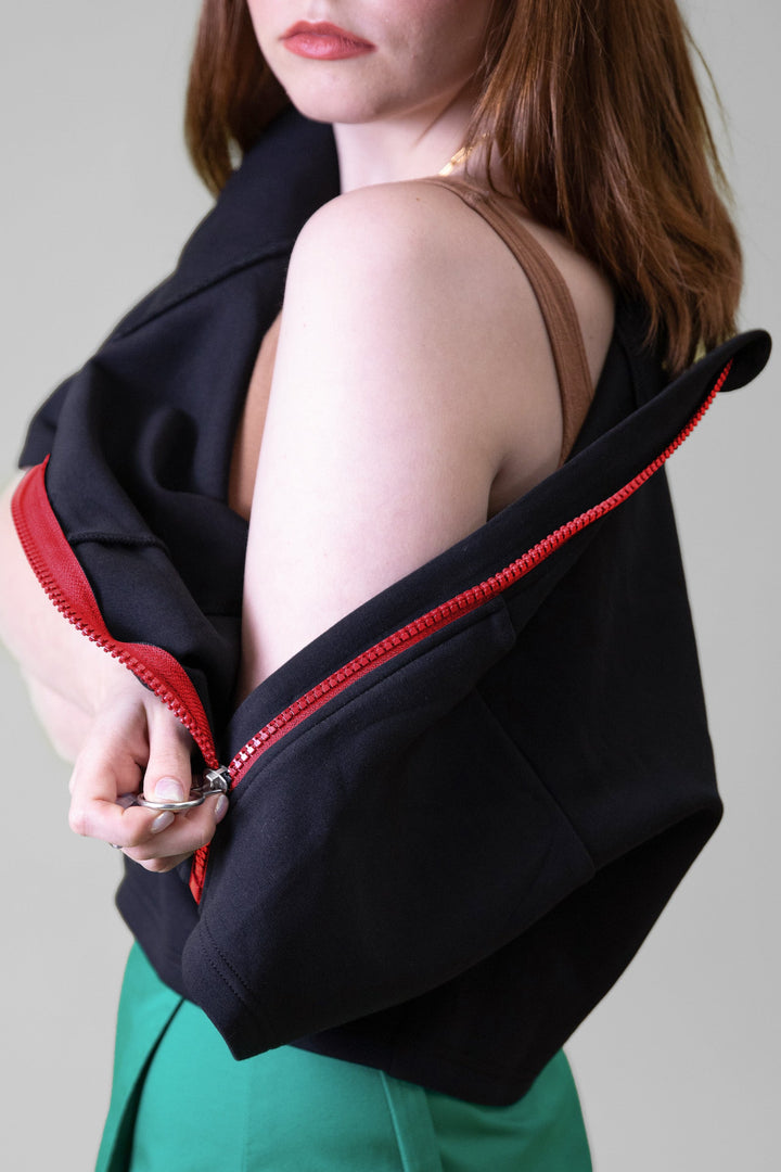Close-up of JAM the Label cropped neoprene zip pullover with the zipper partially open, showcasing the clothing&