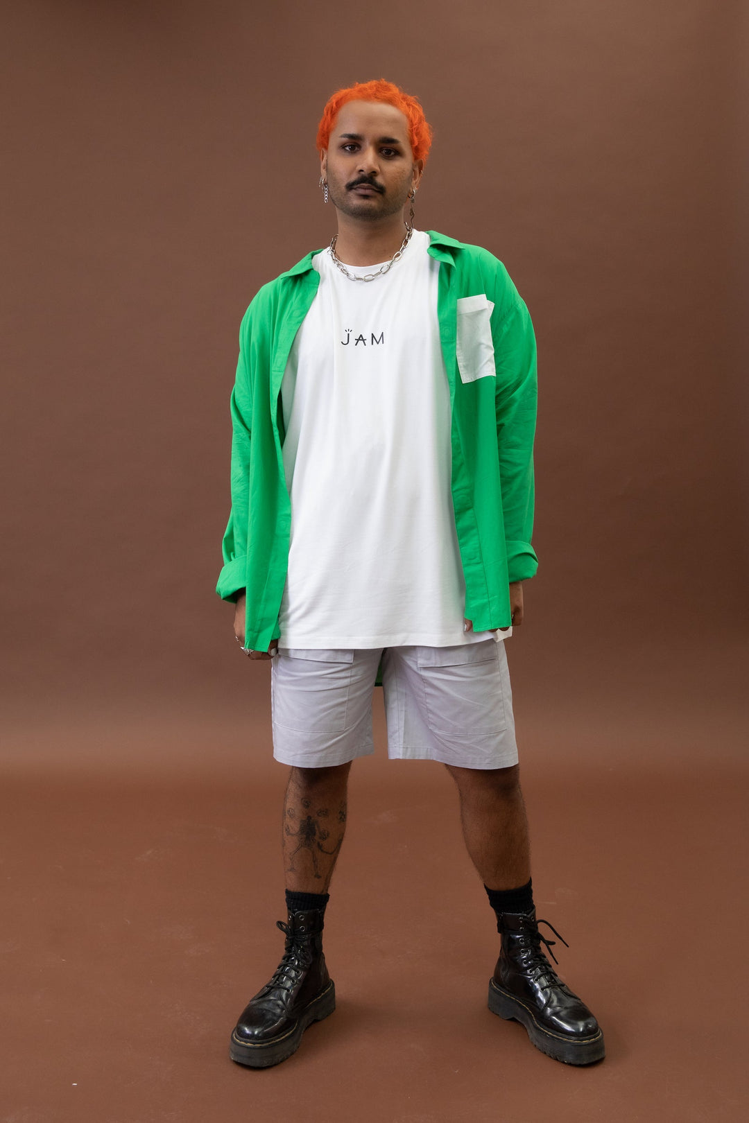 Green long sleeve shirt by JAM the Label, displayed standing front view with an open design.