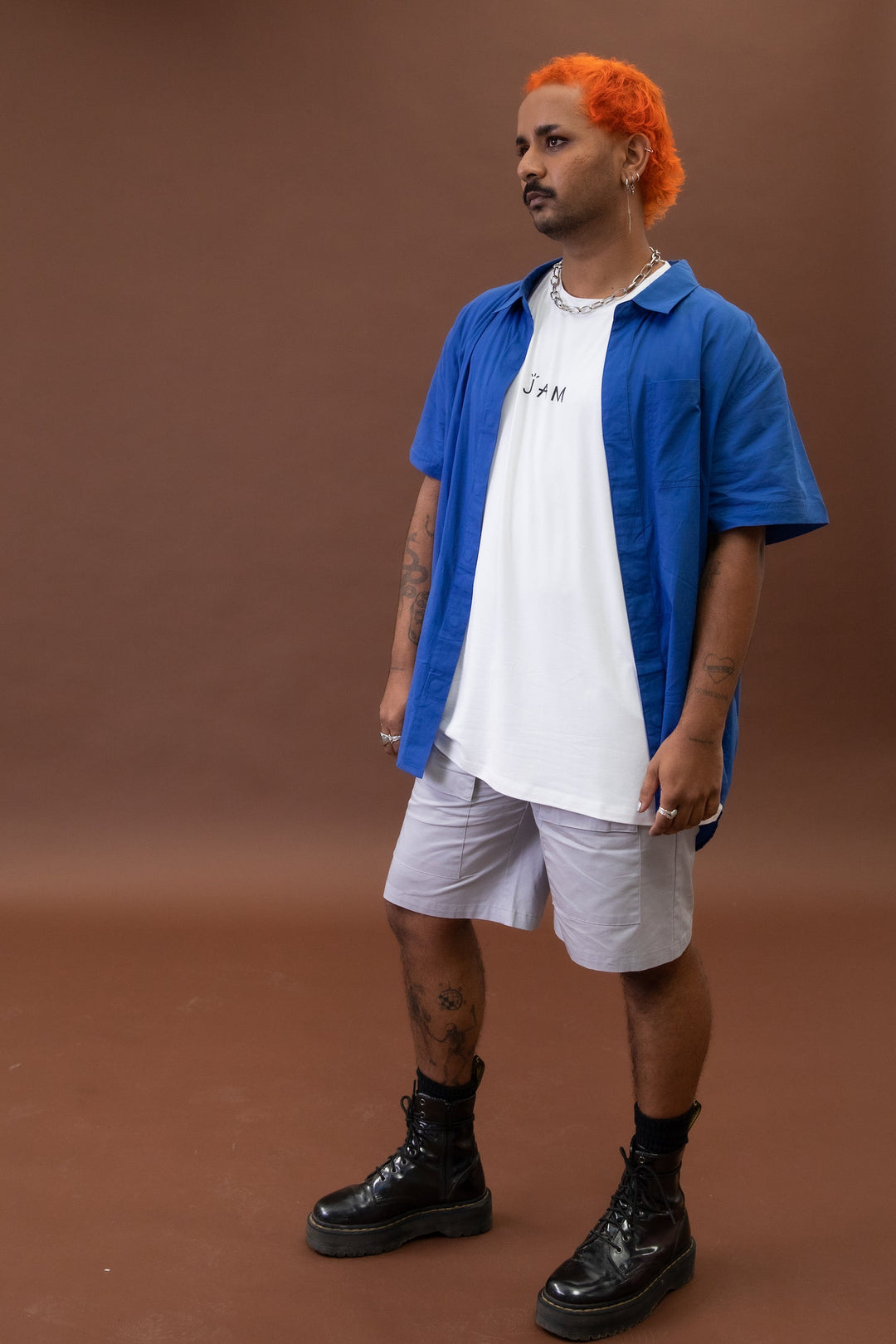 Cobalt blue short sleeve shirt by JAM the Label displayed on a mannequin, showcasing its magnetic closure design.