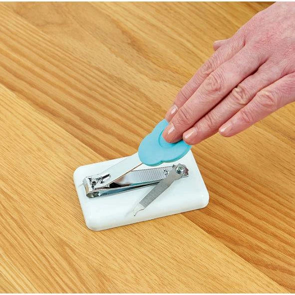 Easi-Grip Table Top Nail Clipper by Performance Health with a hand demonstrating easy nail trimming using the accessory