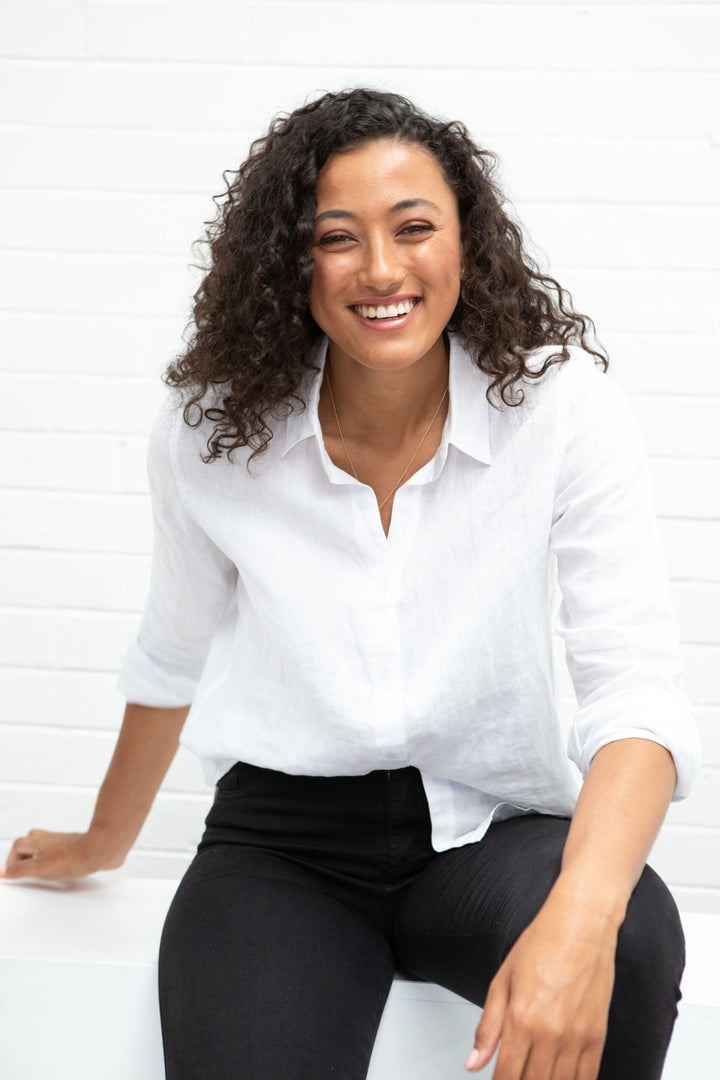 JAM Femme Linen Shirt displayed on a hanger, lightweight and breathable fabric, casual clothing for warm weather.