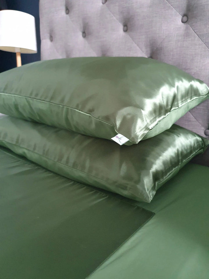 Neeki Designs Wonder PLUS Green Manchester pillow with floral pattern and plush fabric, showcasing vibrant green and intricate design details.