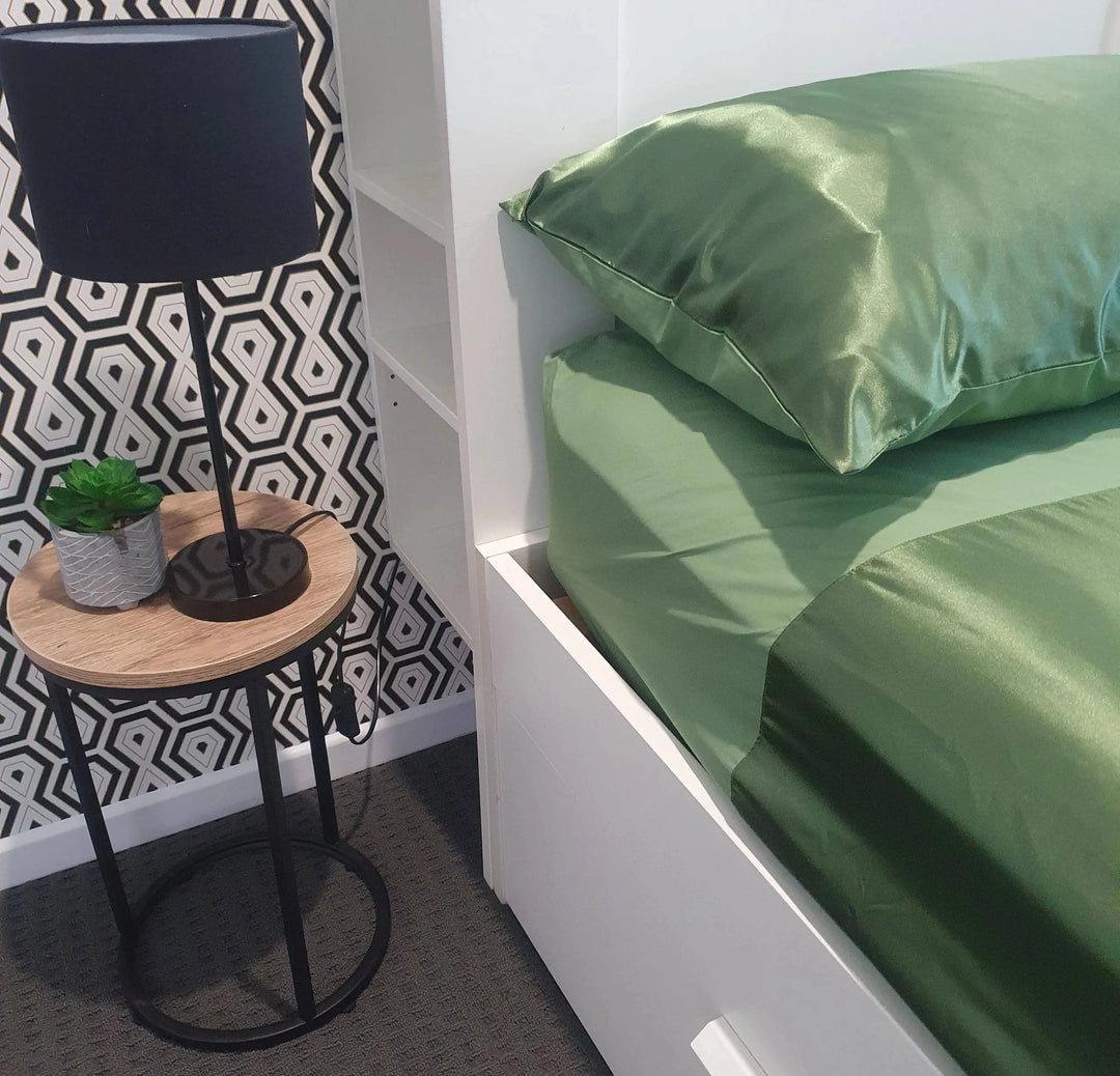 Green Manchester Wonder Sheet by Neeki Designs, featuring soft fabric and stylish design, shown in this image.