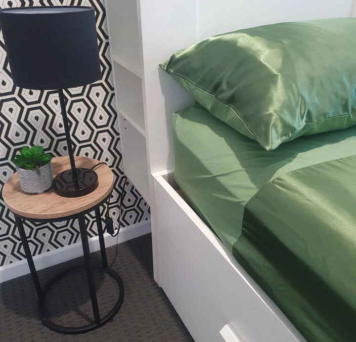 Green Manchester Wonder Sheet by Neeki Designs, featuring soft fabric and stylish design, shown in this image.