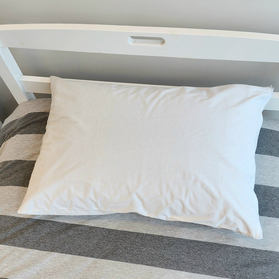 Brolly Sheets waterproof cotton Manchester pillow protector with breathable fabric and secure fit, designed to protect pillows from spills.