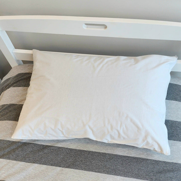 Brolly Sheets waterproof cotton Manchester pillow protector with breathable fabric and secure fit, designed to protect pillows from spills.