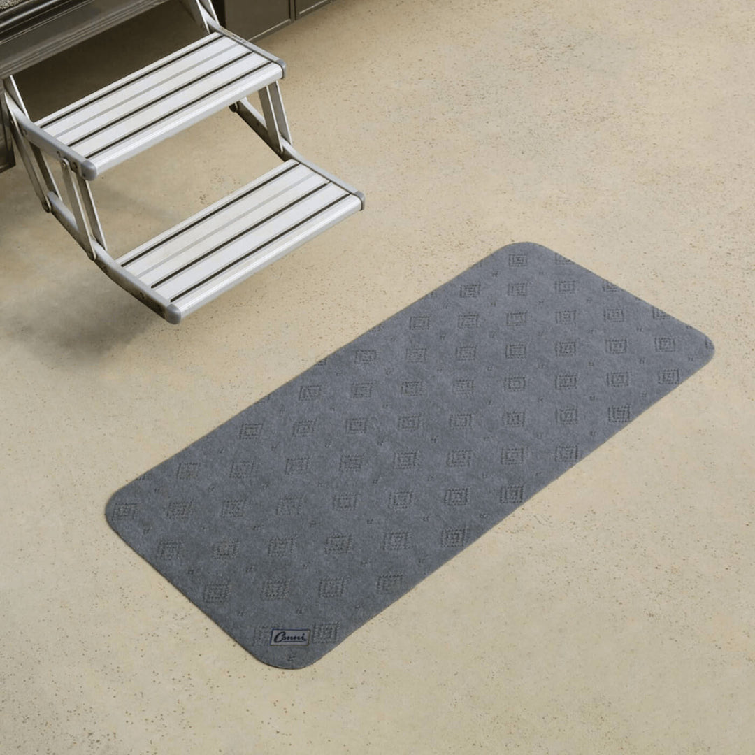 Conni Manchester anti-slip and absorbent floor mat mid runner, beige color, with textured surface for safety and moisture absorption.