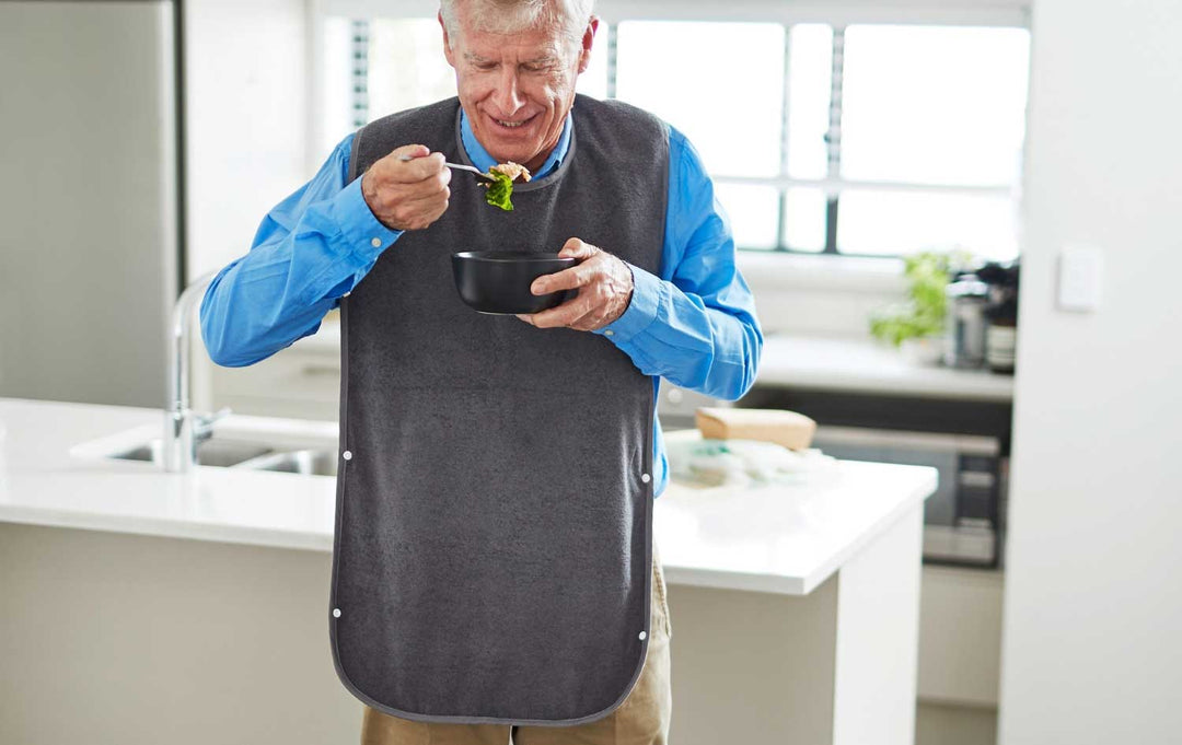 Adult washable tray bib by Brolly Sheets, a practical adaptive clothing accessory for keeping clothes clean.