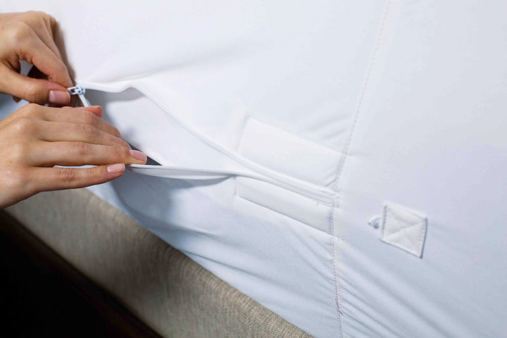 Protect-A-Bed AllerZip fully encased mattress protector in Manchester style, shown installed on a mattress.