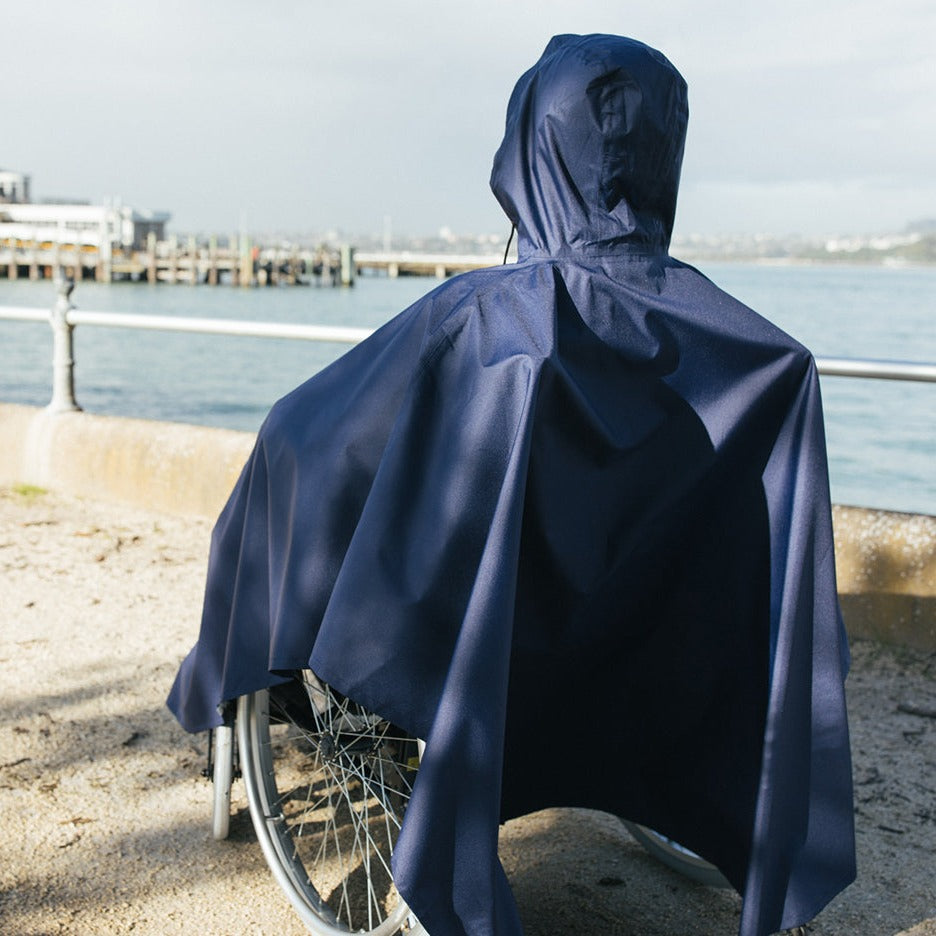 Back view of Brolly Sheets wheelchair rain coat, adaptive clothing designed to keep wheelchair users dry in wet weather.