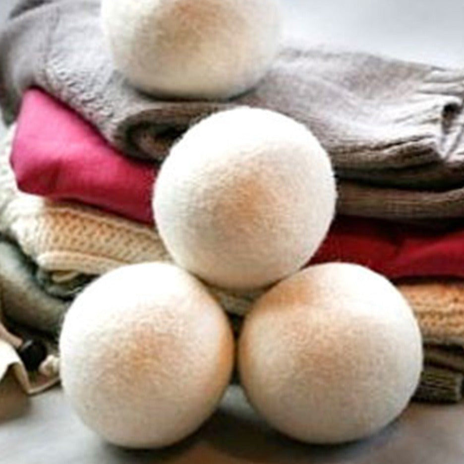 Set of four Brolly NZ Wool Dryer Balls from Brolly Sheets, Manchester brand, shown in a close-up image on a white background.