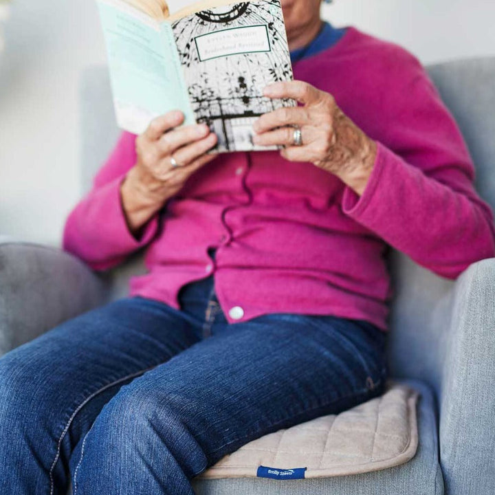 Double-sided waterproof chair pad in navy and beige by Brolly Sheets, designed for added comfort and protection.
