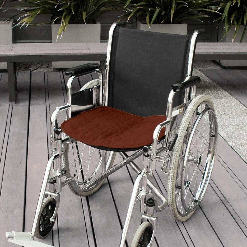 Double-sided waterproof chair pad in brown for wheelchairs by Brolly Sheets, showcasing its plush texture and functional design.