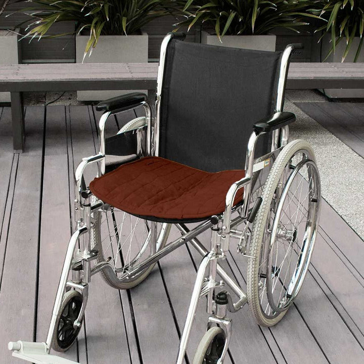 Double-sided waterproof chair pad in brown for wheelchairs by Brolly Sheets, showcasing its plush texture and functional design.