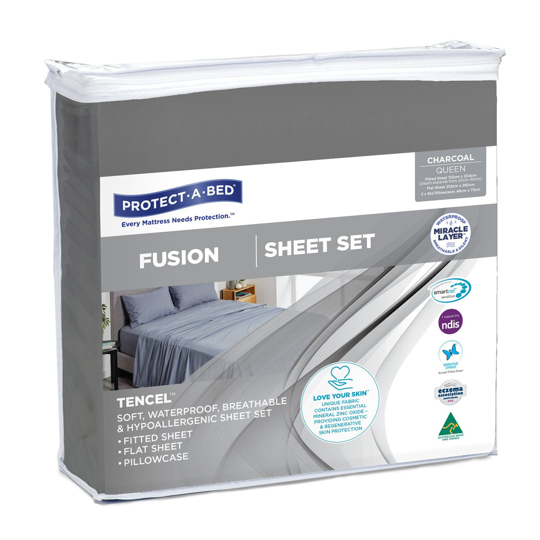 Charcoal Protect-A-Bed® Fusion waterproof sheet set displayed on a bed, showcasing soft fabric and fitted design.