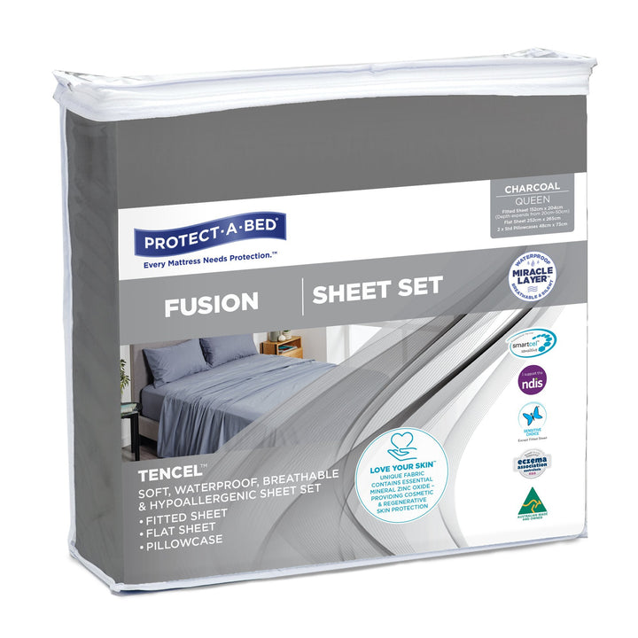 Charcoal Protect-A-Bed® Fusion waterproof sheet set displayed on a bed, showcasing soft fabric and fitted design.