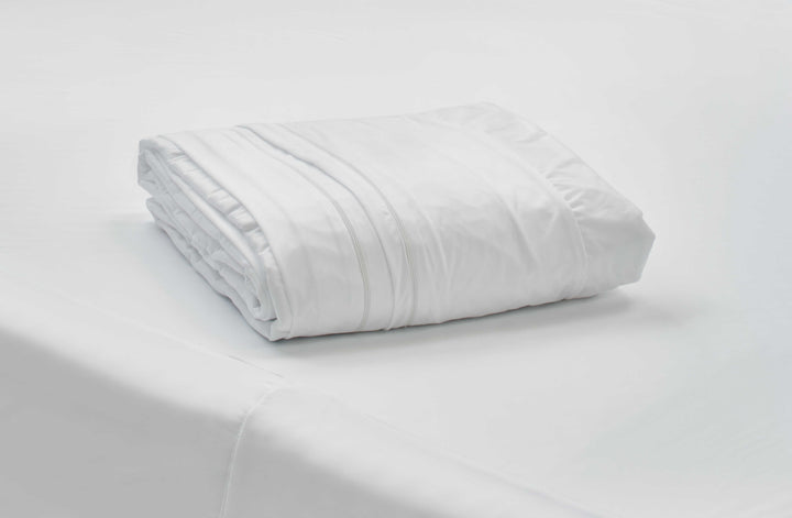 Protect-A-Bed Allerzip fully encased mattress protector in white fabric, designed for Manchester mattresses.