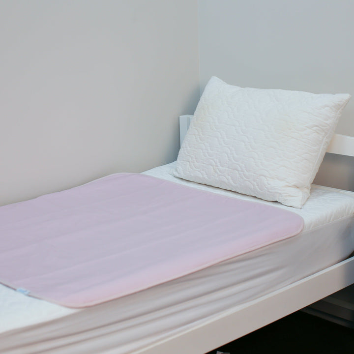 Manchester Brolly Bed Pad without wings from Brolly Sheets, soft absorbent fabric for bed protection.