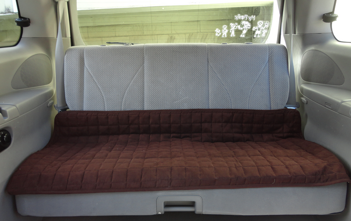 Large brown Brolly Sheets seat protector in a car backseat, measuring 120cm x 60cm, showcasing waterproof material.