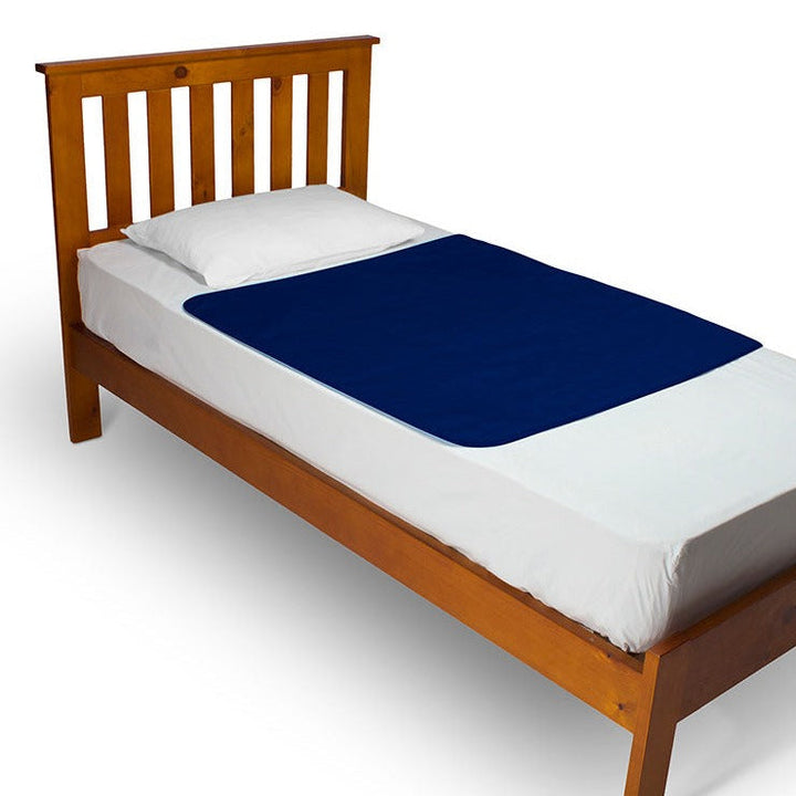 Navy Brolly Bed Pad without wings from Brolly Sheets, Manchester waterproof mattress protector for added bed protection.