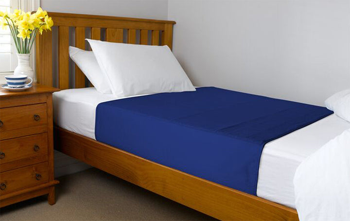 Navy Brolly Sheets bed pad with wings, designed for King Single beds, featuring a soft and absorbent fabric.