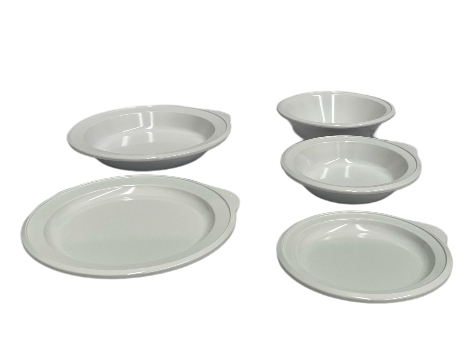 All-white Omni 5-piece adaptive dining ware set by Euroswift, including plates, bowls, and utensils for easy dining assistance.