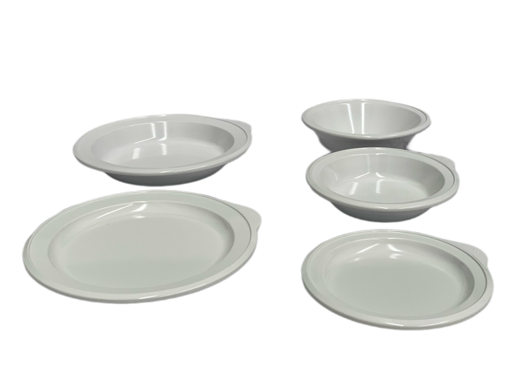 All-white Omni 5-piece adaptive dining ware set by Euroswift, including plates, bowls, and utensils for easy dining assistance.