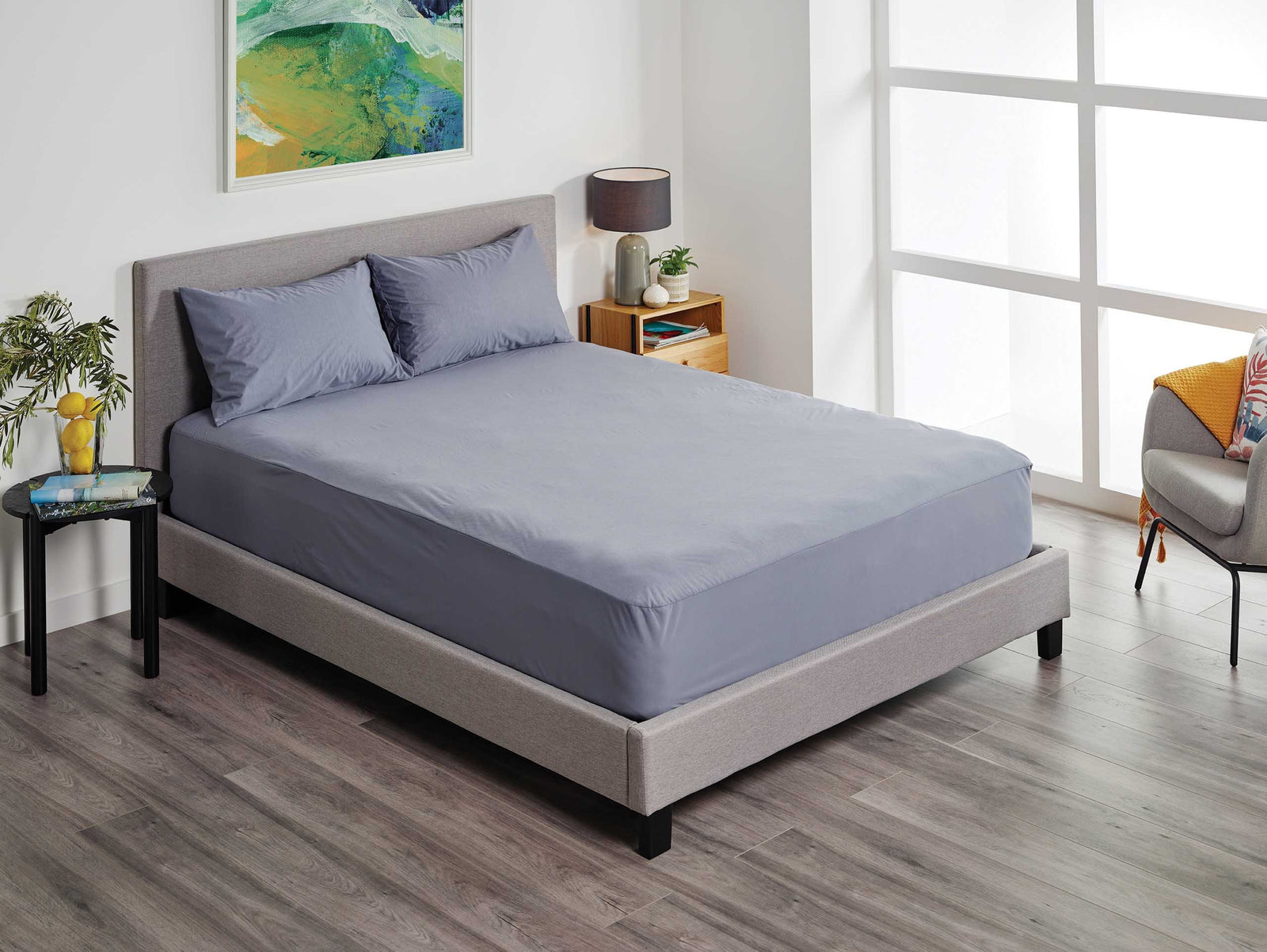 Charcoal Protect-A-Bed® Fusion waterproof pillowcases by SleepCorp® on a smooth surface, showcasing their sleek design.