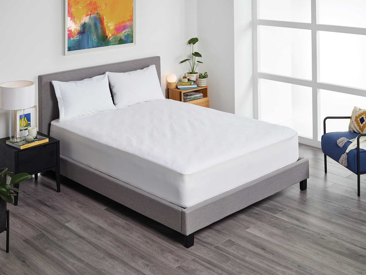 Protect-A-Bed Impression Tencel Jacquard mattress protector on a mattress, showcasing the Manchester style and luxurious jacquard fabric.