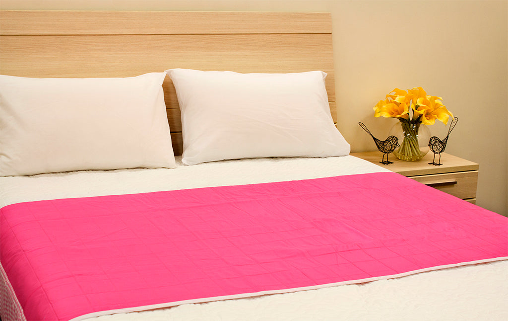Pink Brolly Sheets bed pad with wings for double, queen, or king size beds, showcasing soft fabric and practical design.