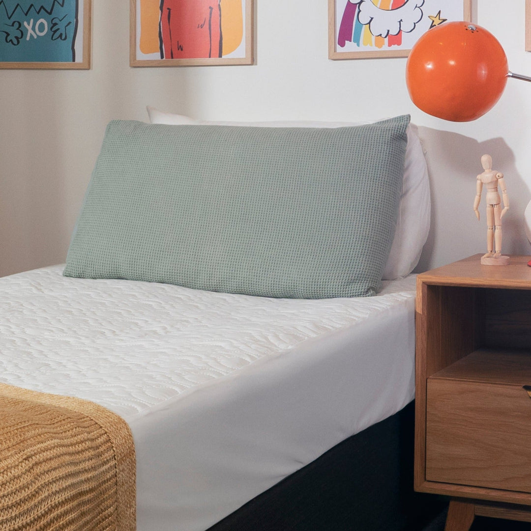Brolly Sheets waterproof quilted mattress protector for single bed, featuring a soft, textured surface and secure fit.