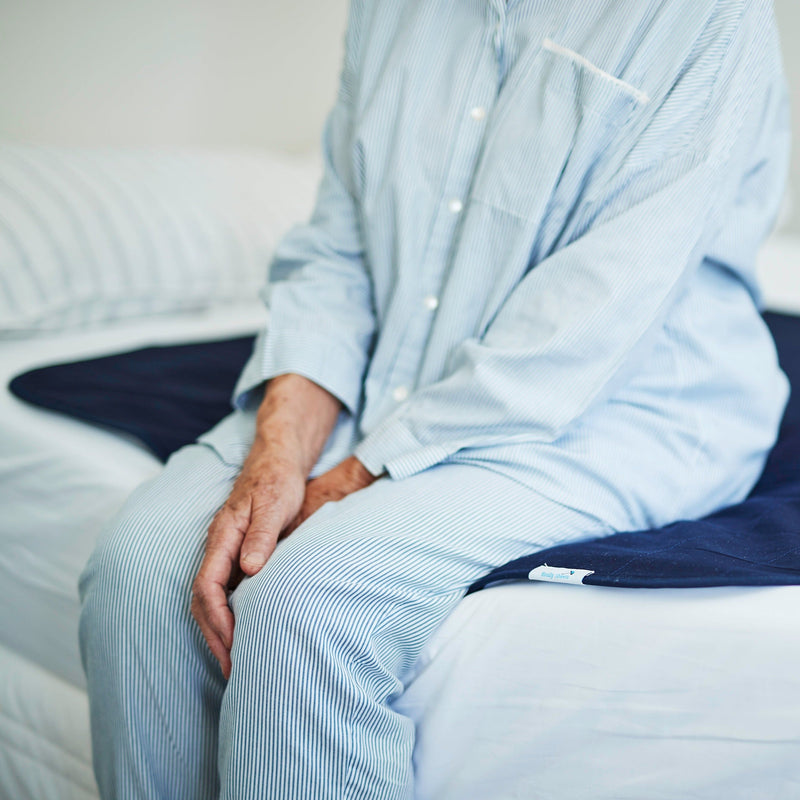 women sit on waterproof bed pad