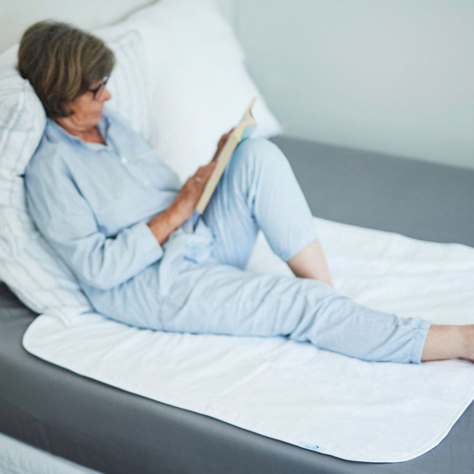 White washable Manchester Brolly Bed Pad from Brolly Sheets, without wings, designed for comfortable, reusable bedding protection.