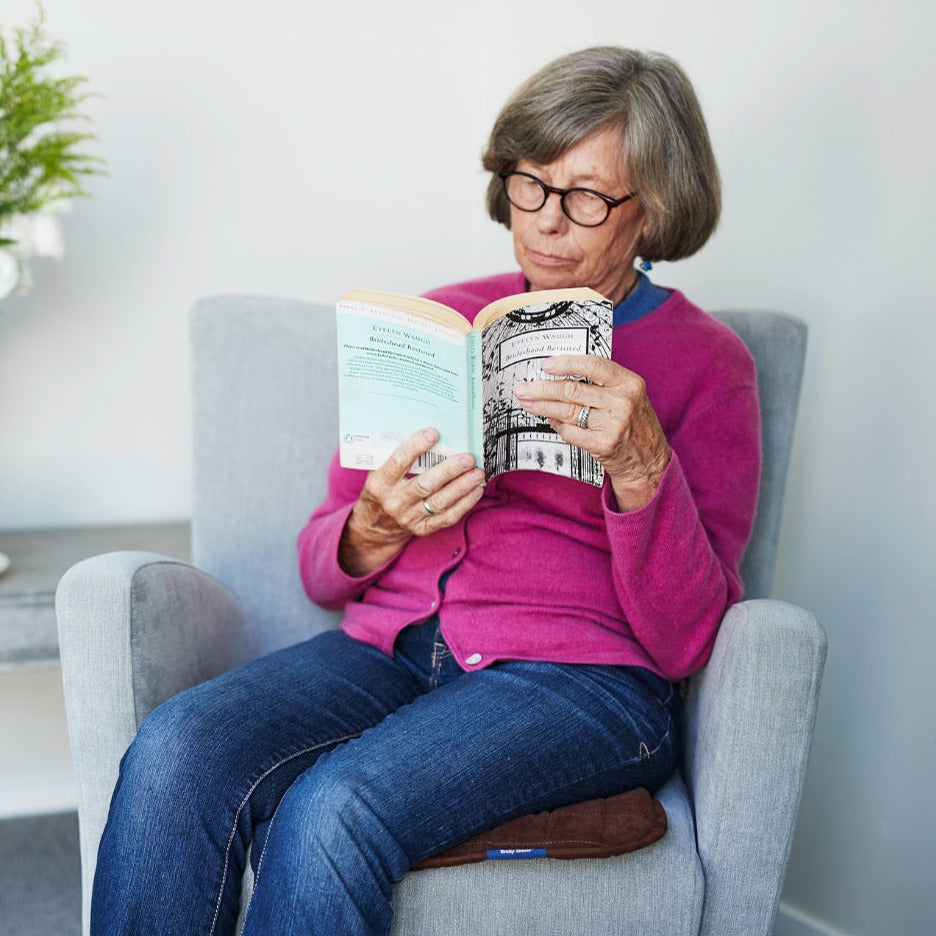 Double-sided waterproof chair pad by Brolly Sheets, designed for seniors, featuring a washable and comfortable surface.