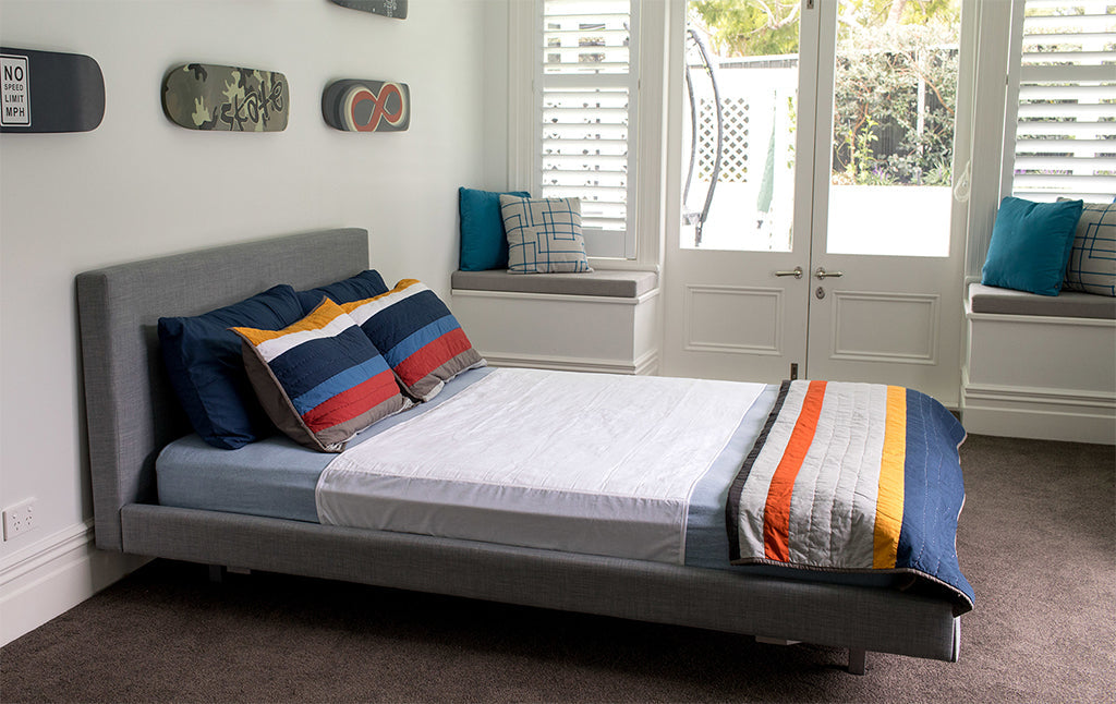 White double queen Brolly Sheets brolly sheet bed pad with wings, Manchester brand, designed for extra comfort and protection.