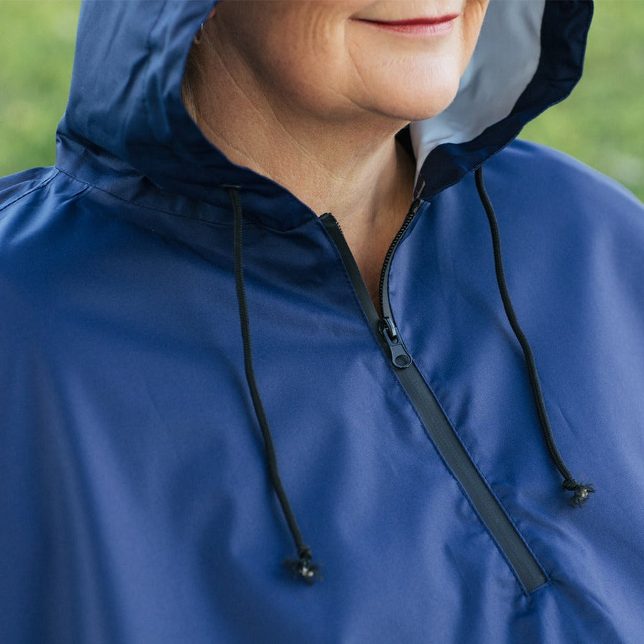Close-up of Brolly Sheets wheelchair rain coat zipper, adaptive clothing designed for wheelchair users to stay dry in rainy weather.