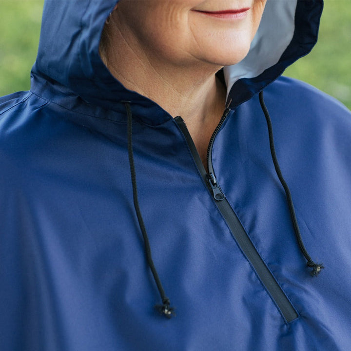 Close-up of Brolly Sheets wheelchair rain coat zipper, adaptive clothing designed for wheelchair users to stay dry in rainy weather.