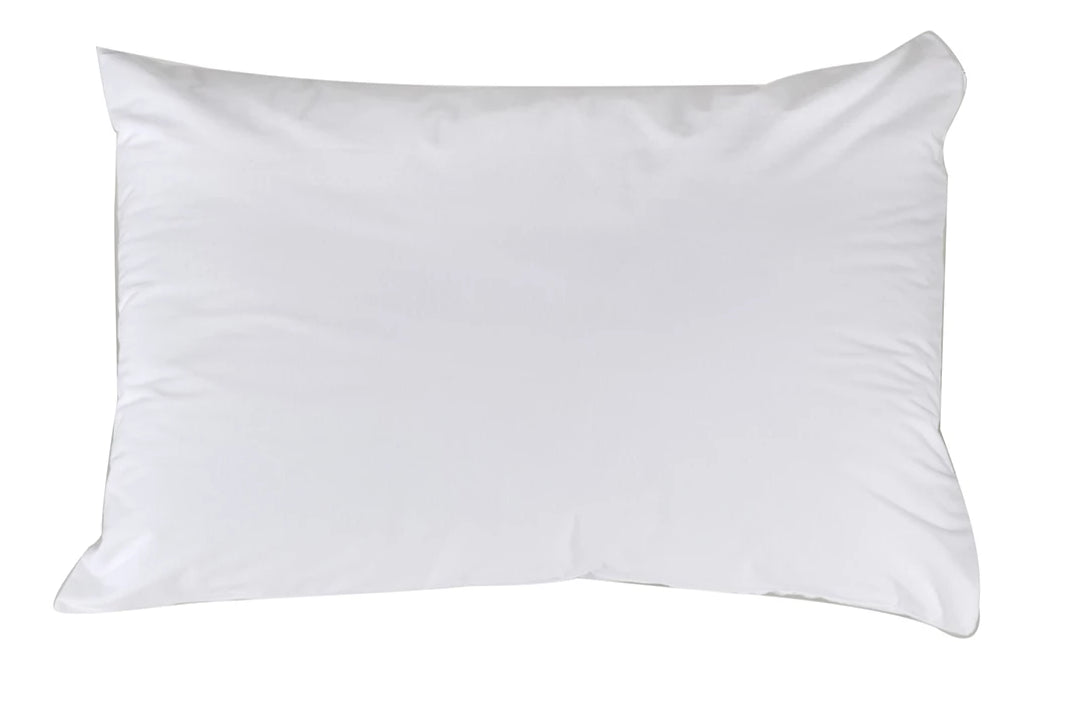 Brolly Sheets waterproof cotton pillow protector on a bed, designed for Manchester bedding comfort and protection.