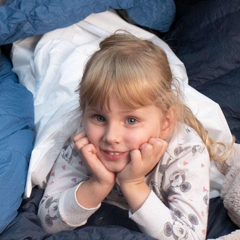 girl smiling in waterproof sleeping bag